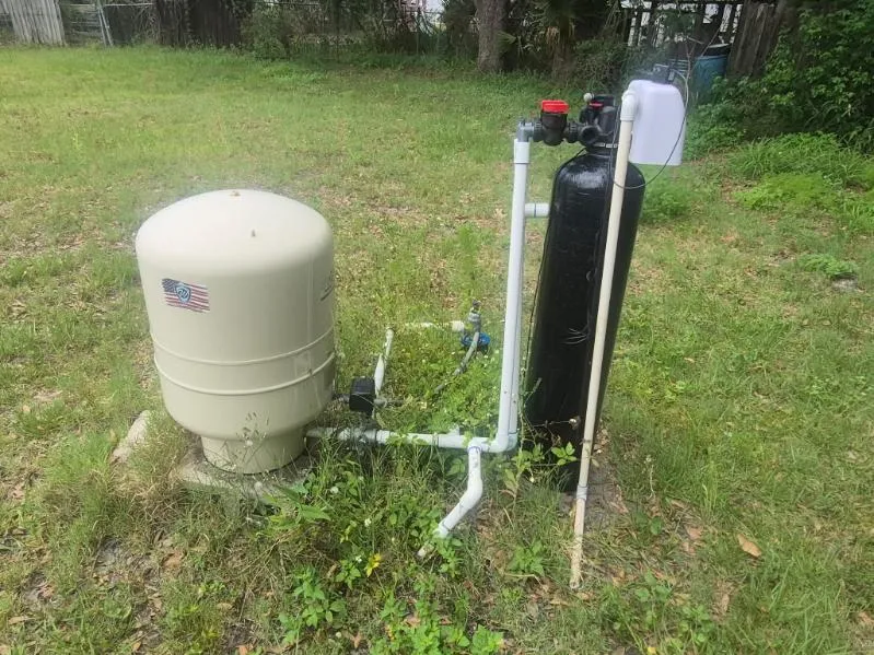 Water filtration tank and pressure tank plumbed in at the wellhead